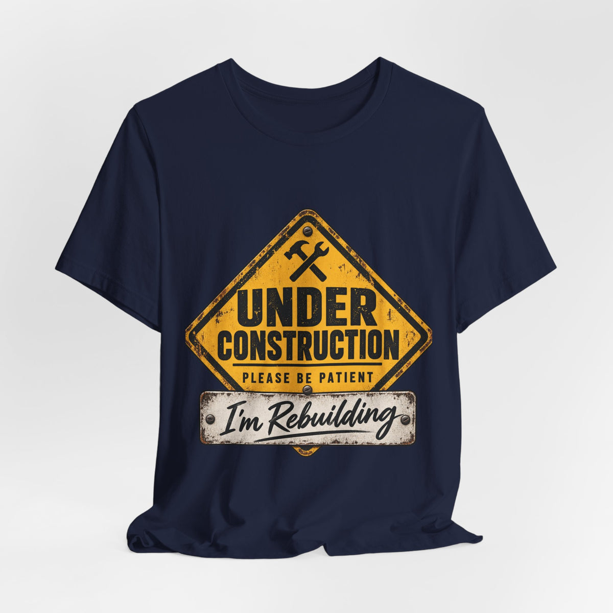 Under Construction — Unisex Tee | I’m Rebuilding — Roots Recovery Housing