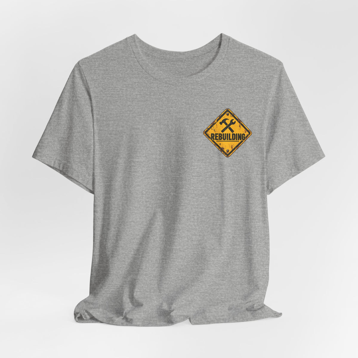 Under Construction — Unisex Tee | I’m Rebuilding — Roots Recovery Housing