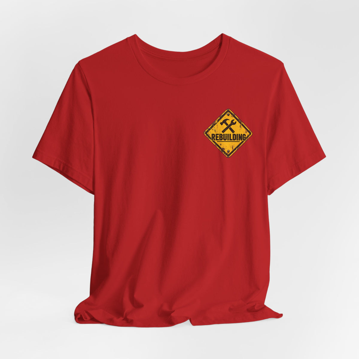 Under Construction — Unisex Tee | I’m Rebuilding — Roots Recovery Housing
