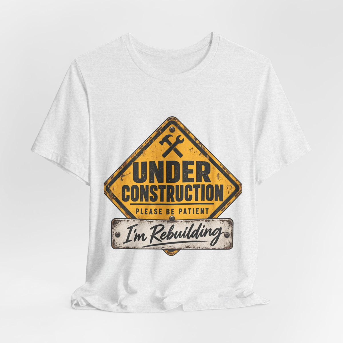 Under Construction — Unisex Tee | I’m Rebuilding — Roots Recovery Housing