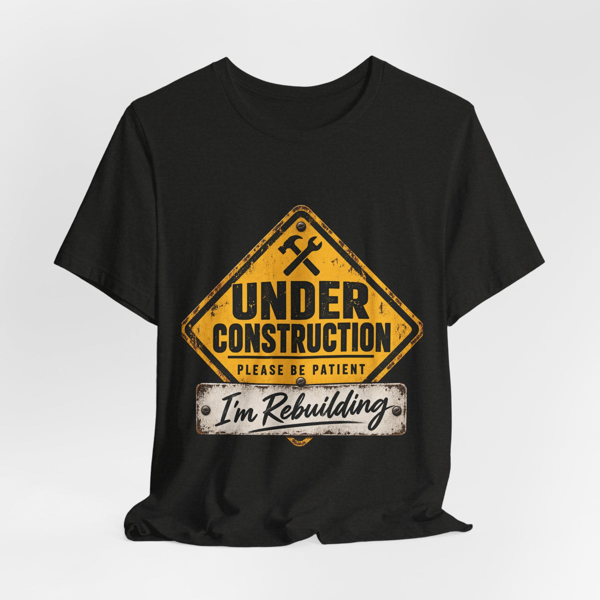 Under Construction — Unisex Tee | I’m Rebuilding — Roots Recovery Housing