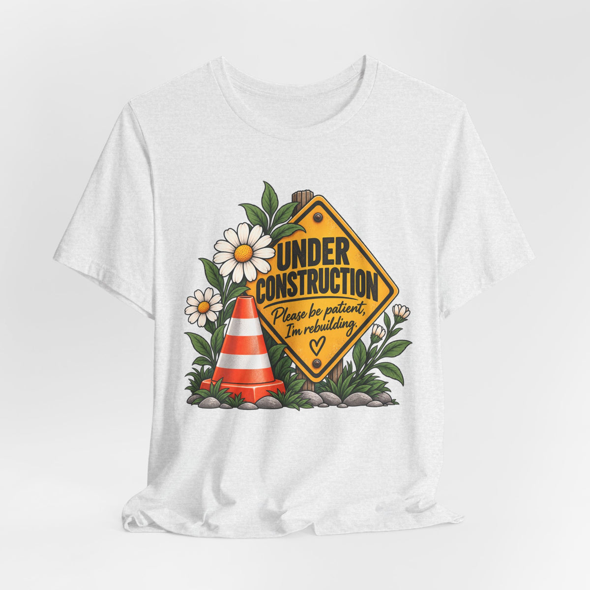 Under Construction — Women’s Tee | Still Becoming — Roots Recovery Housing