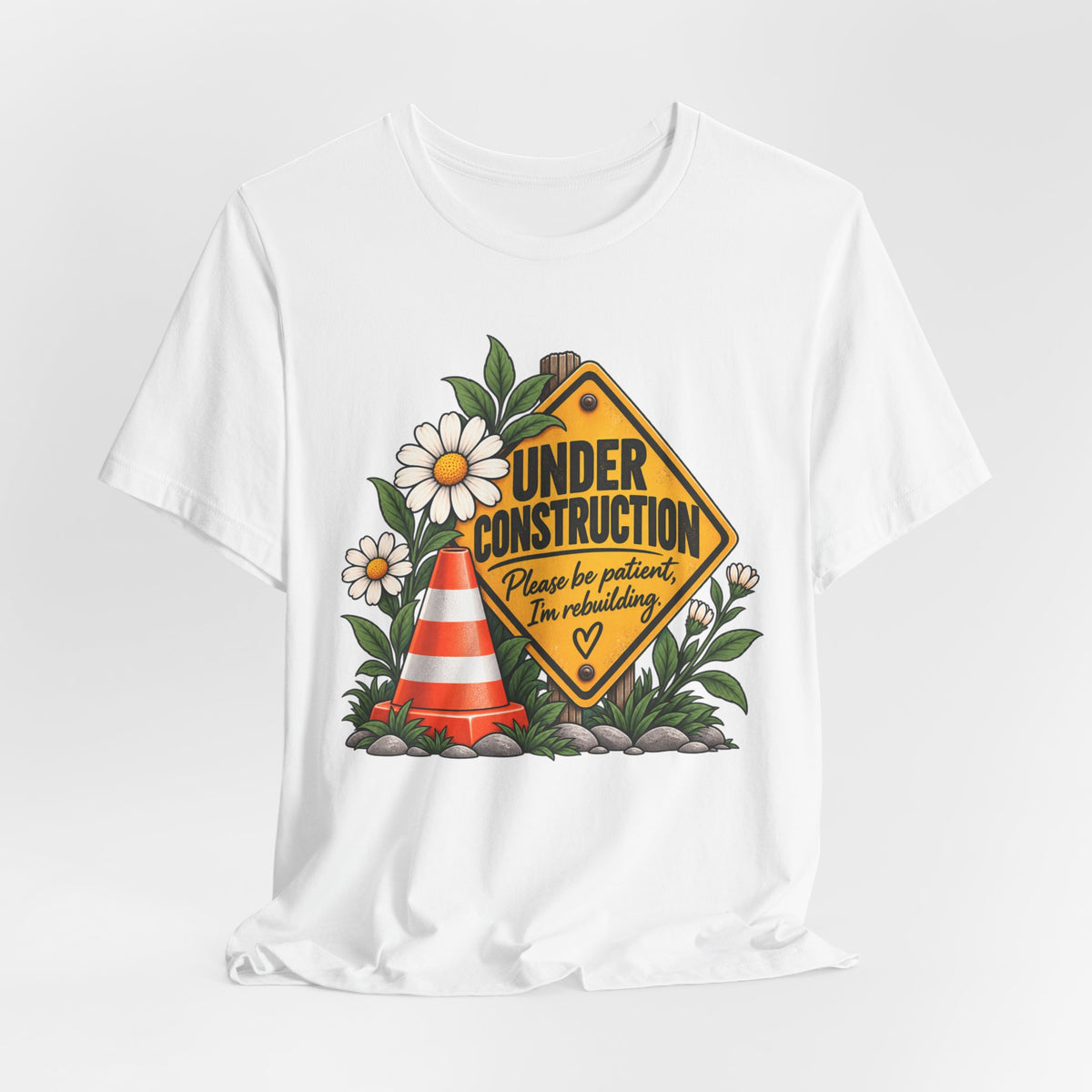 Under Construction — Women’s Tee | Still Becoming — Roots Recovery Housing