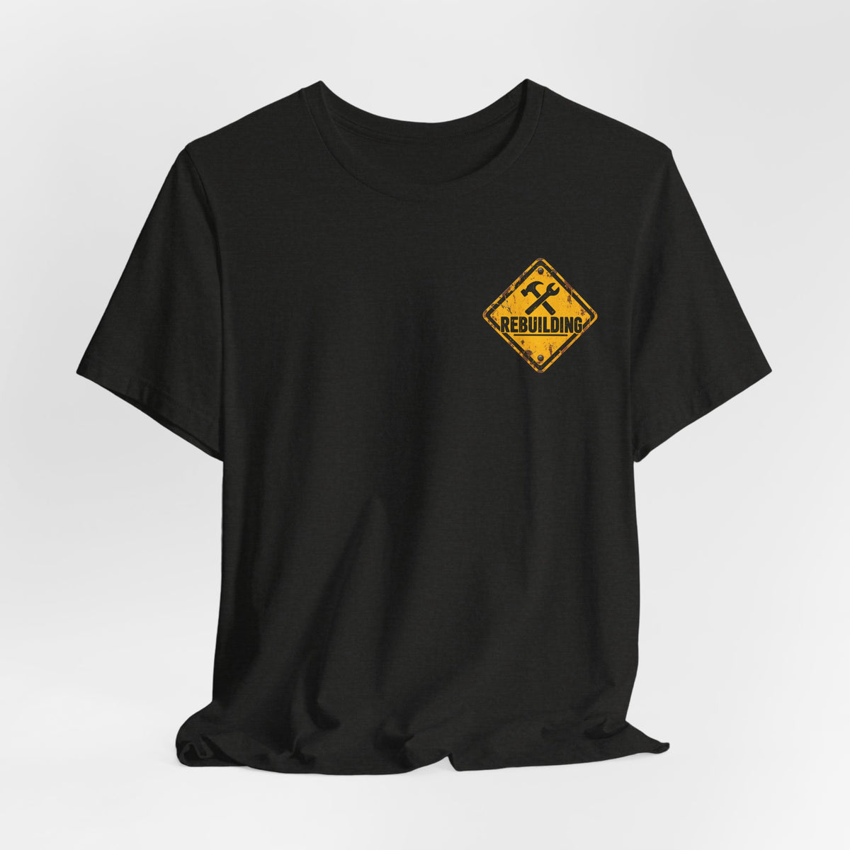 Under Construction — Unisex Tee | I’m Rebuilding — Roots Recovery Housing