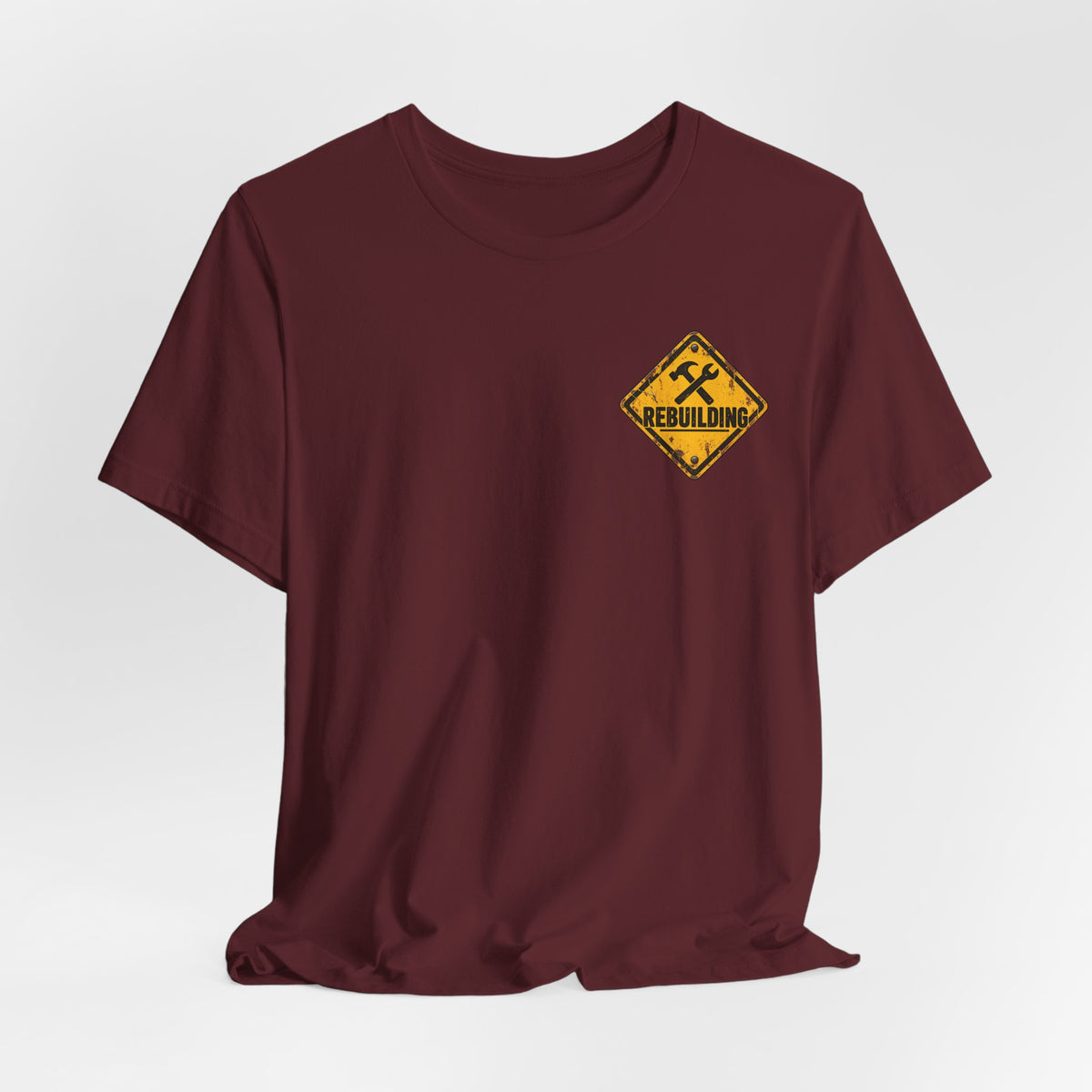 Under Construction — Unisex Tee | I’m Rebuilding — Roots Recovery Housing