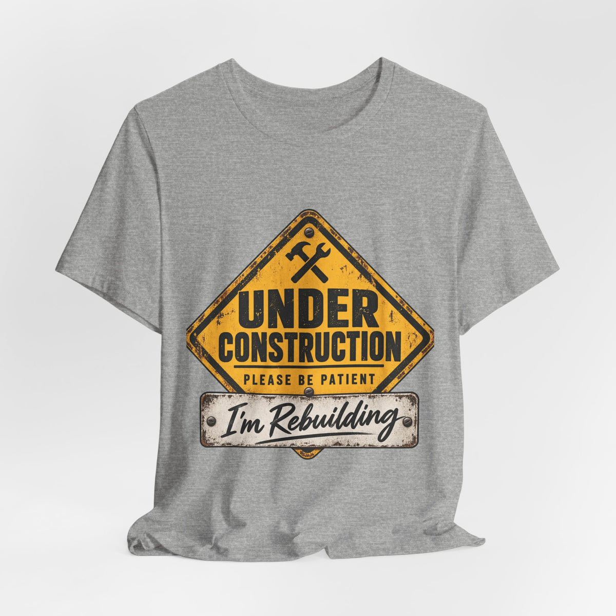 Under Construction — Unisex Tee | I’m Rebuilding — Roots Recovery Housing