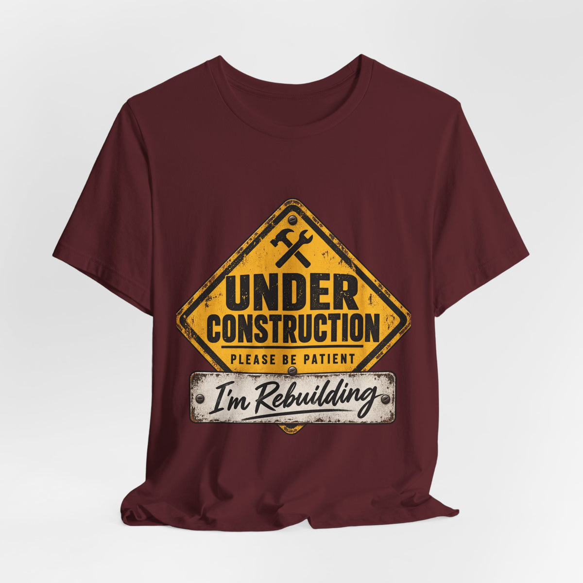 Under Construction — Unisex Tee | I’m Rebuilding — Roots Recovery Housing
