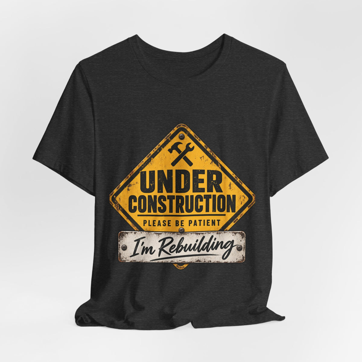 Under Construction — Unisex Tee | I’m Rebuilding — Roots Recovery Housing
