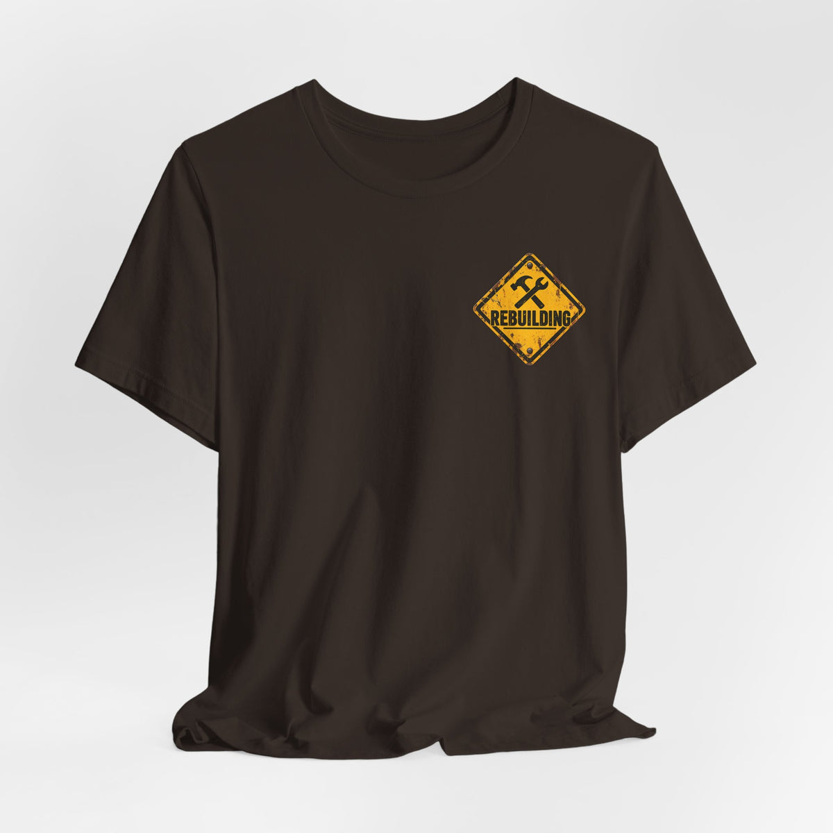 Under Construction — Unisex Tee | I’m Rebuilding — Roots Recovery Housing