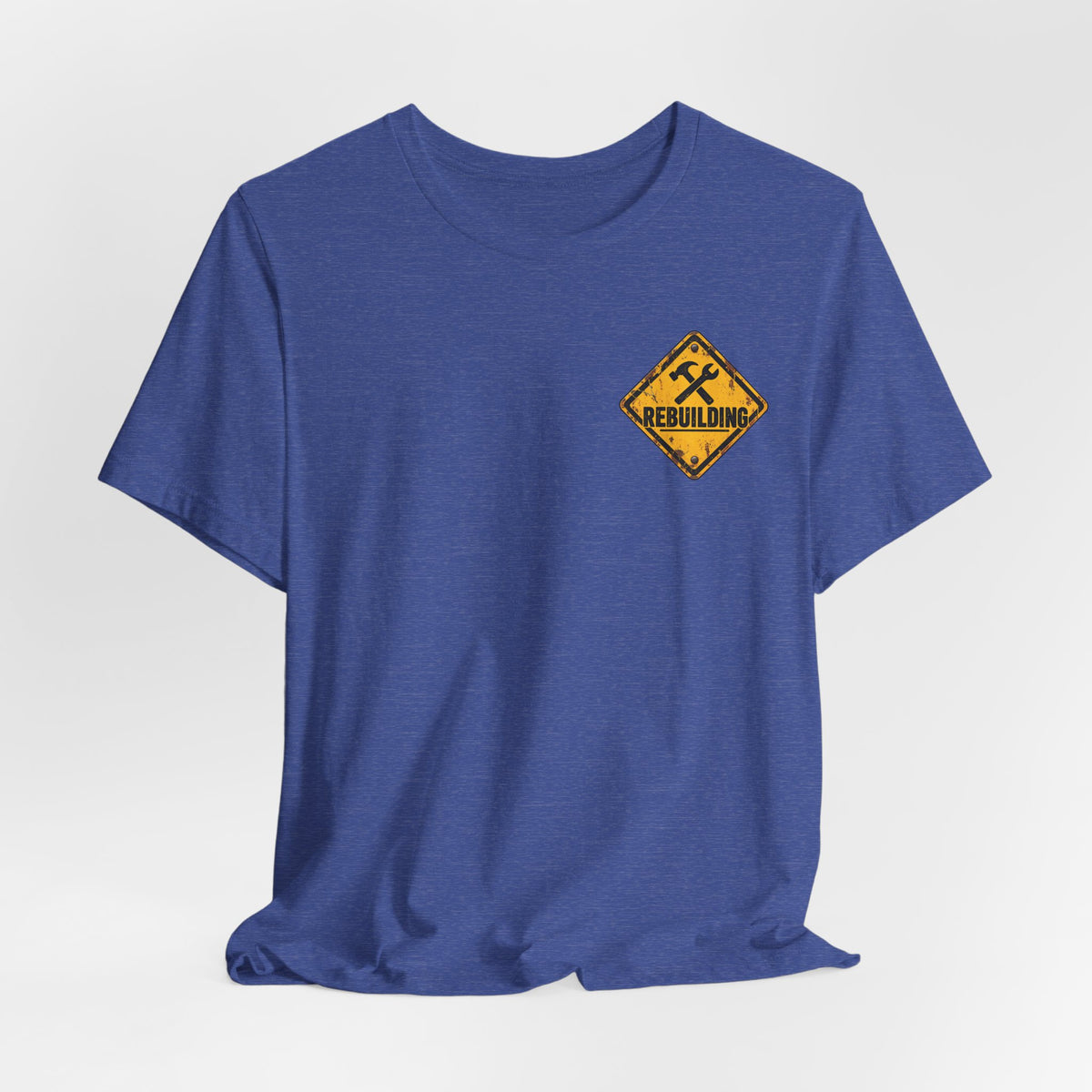 Under Construction — Unisex Tee | I’m Rebuilding — Roots Recovery Housing