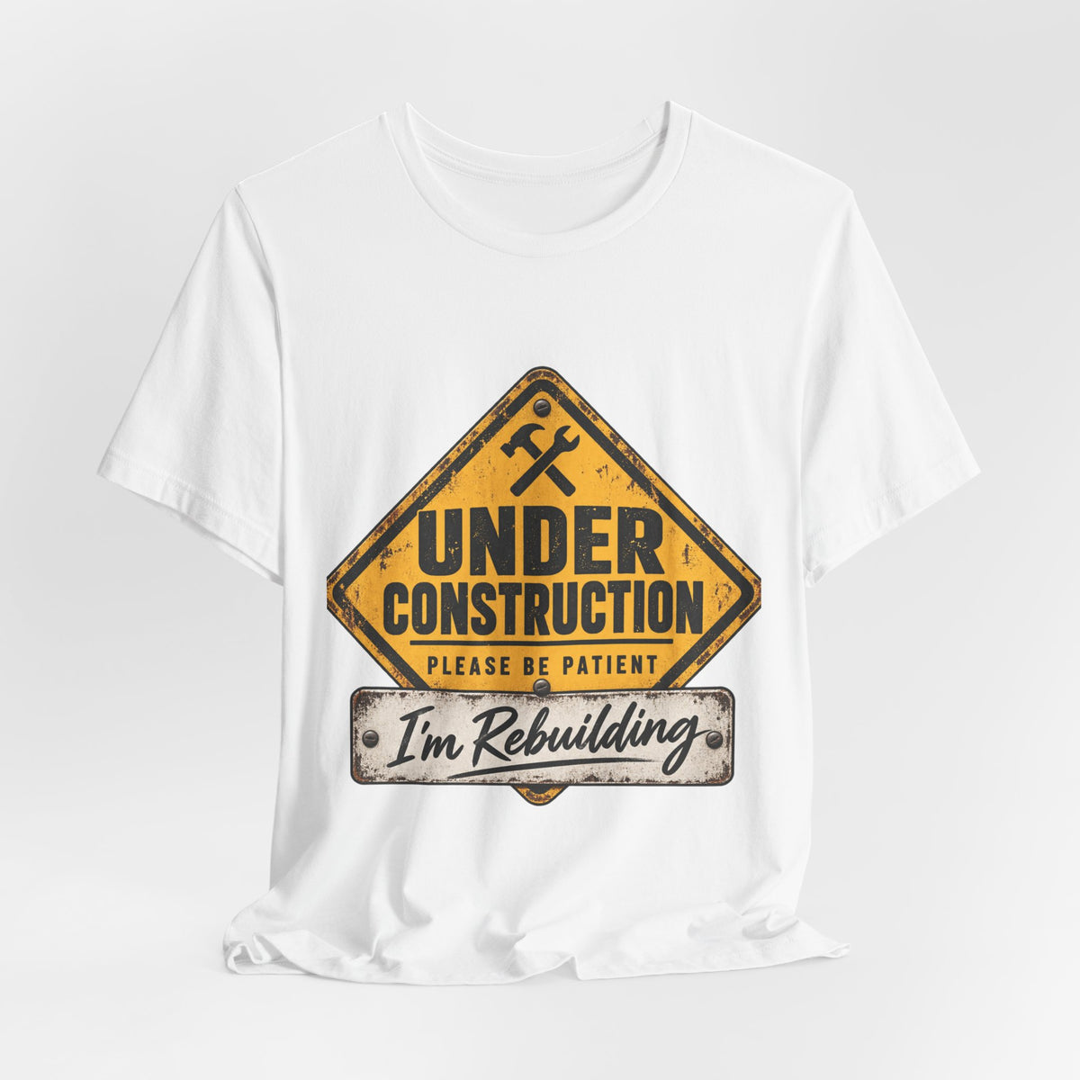 Under Construction — Unisex Tee | I’m Rebuilding — Roots Recovery Housing