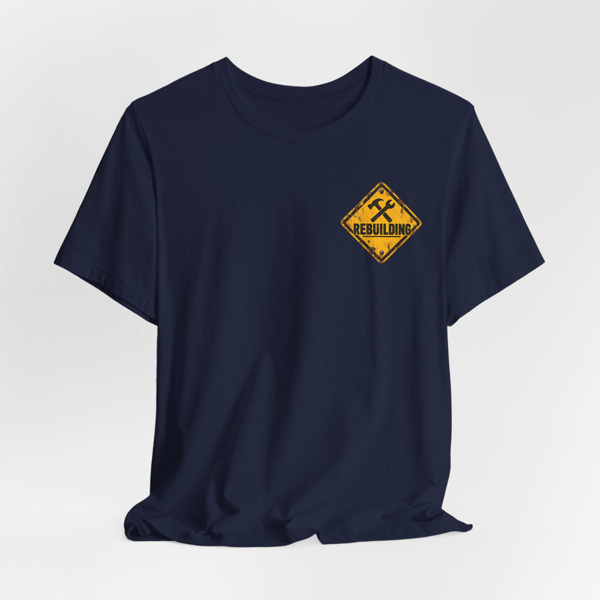 Under Construction — Unisex Tee | I’m Rebuilding — Roots Recovery Housing