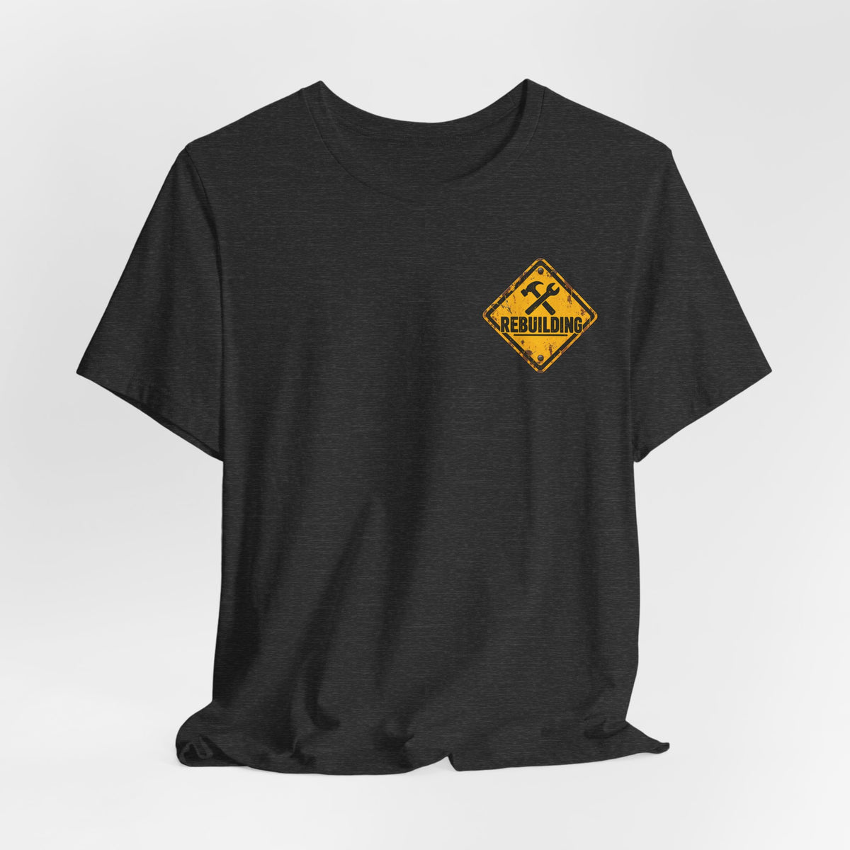 Under Construction — Unisex Tee | I’m Rebuilding — Roots Recovery Housing