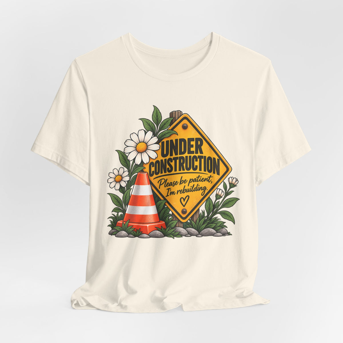 Under Construction — Women’s Tee | Still Becoming — Roots Recovery Housing